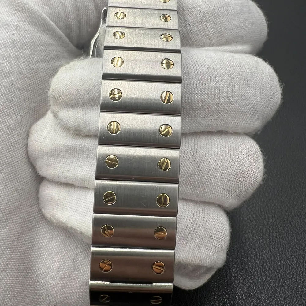 Bracelet à vis d’une montre Cartier Santos or et acier